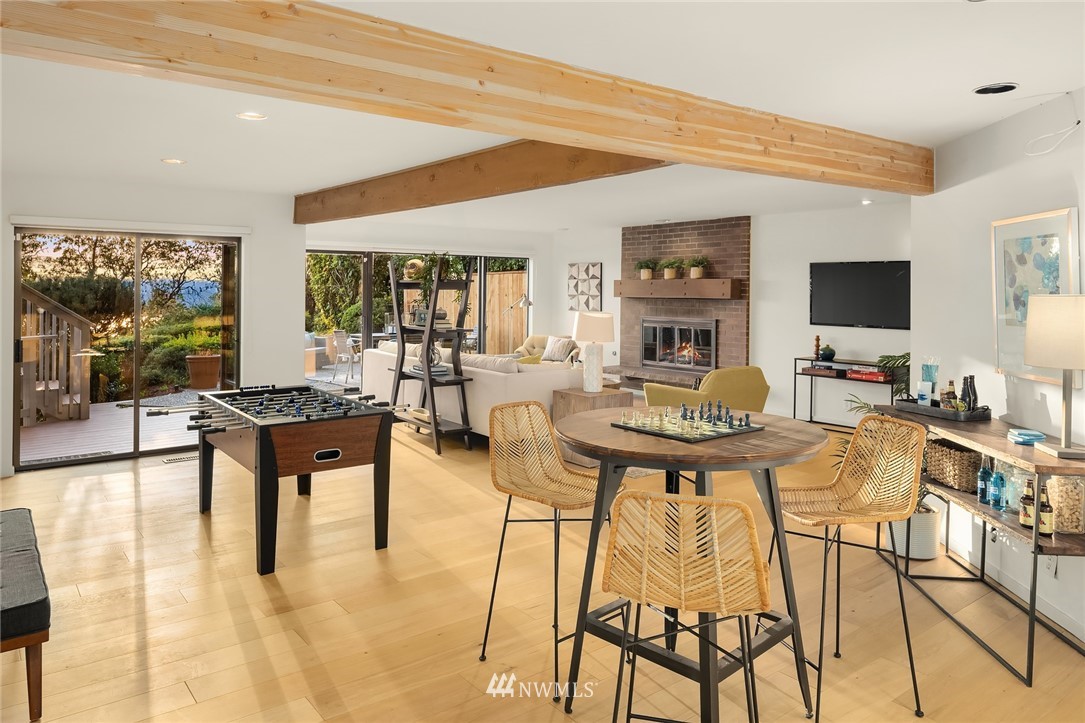 7701 Ridgecrest Lane Mercer Island, WA 98040 - Photo 28 of 35 a living room with fireplace furniture and a flat screen tv