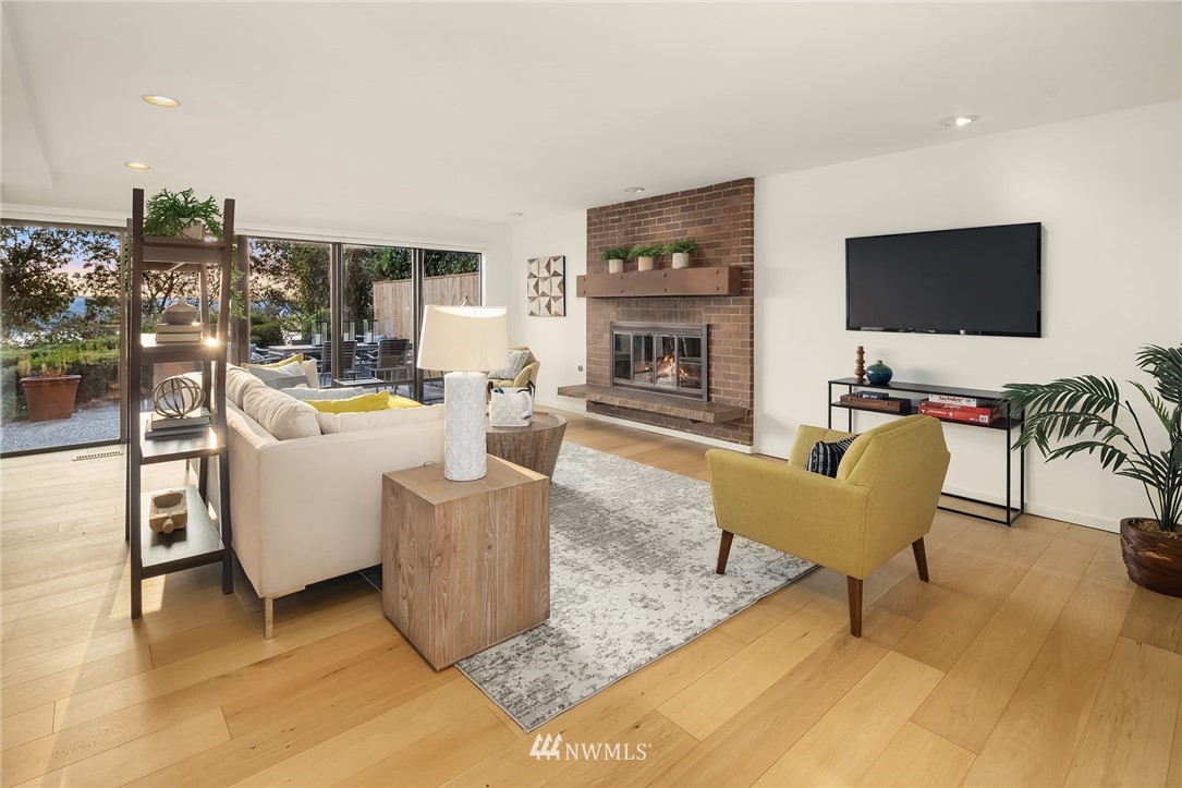 7701 Ridgecrest Lane Mercer Island, WA 98040 - Photo 29 of 35 a living room with furniture and a flat screen tv