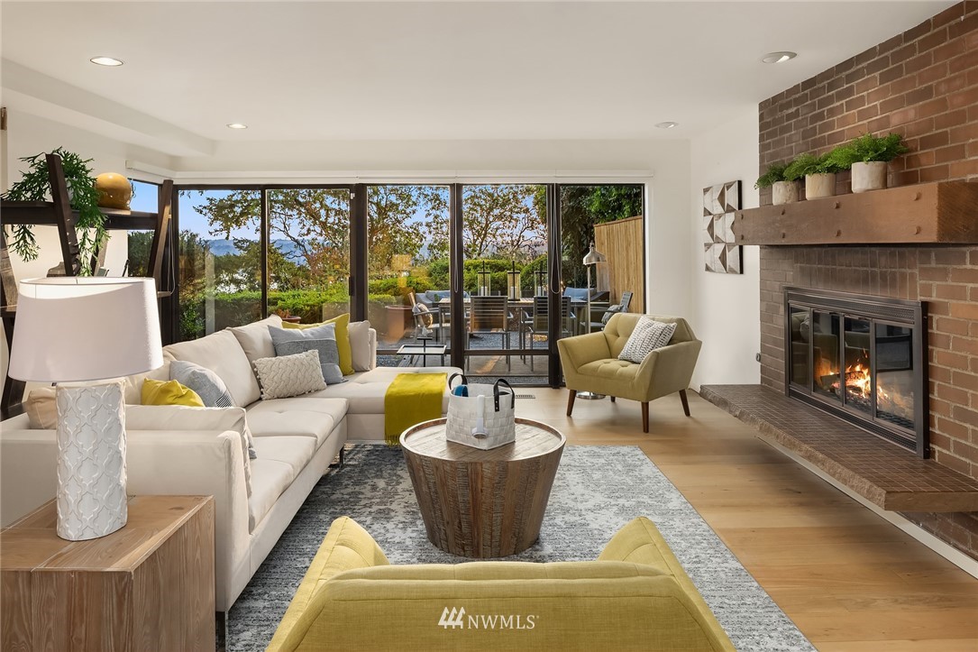 7701 Ridgecrest Lane Mercer Island, WA 98040 - Photo 30 of 35 a living room with furniture and a fireplace