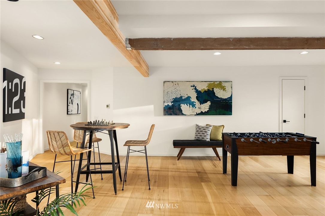 7701 Ridgecrest Lane Mercer Island, WA 98040 - Photo 31 of 35 a reading room with furniture a rug and a painting