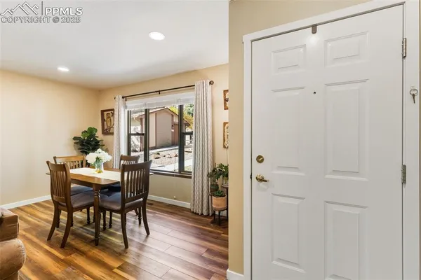 a view of a dining room with furniture window and wooden floor