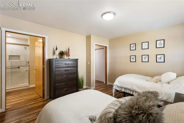 a bedroom with a bed and a dresser