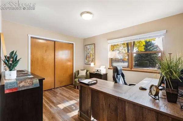 a kitchen with sink refrigerator and large window