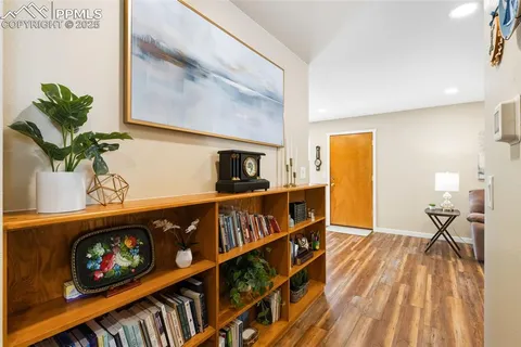 a view of an entryway with wooden floor