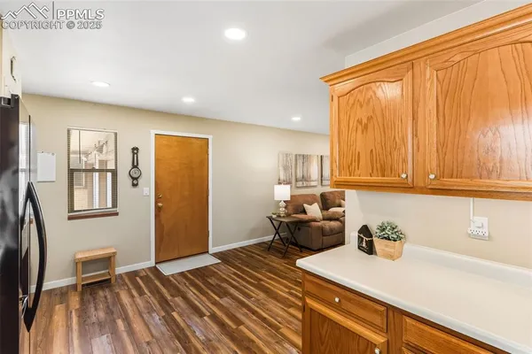 a kitchen with stainless steel appliances sink refrigerator and window