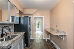 1618 Roundhill Road Baltimore, MD 21218 - Photo 18 of 50 a kitchen with granite countertop a sink stove and refrigerator