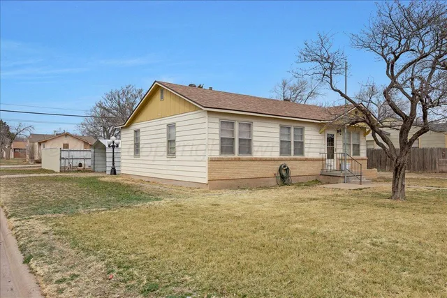 a house that has a tree in front of it