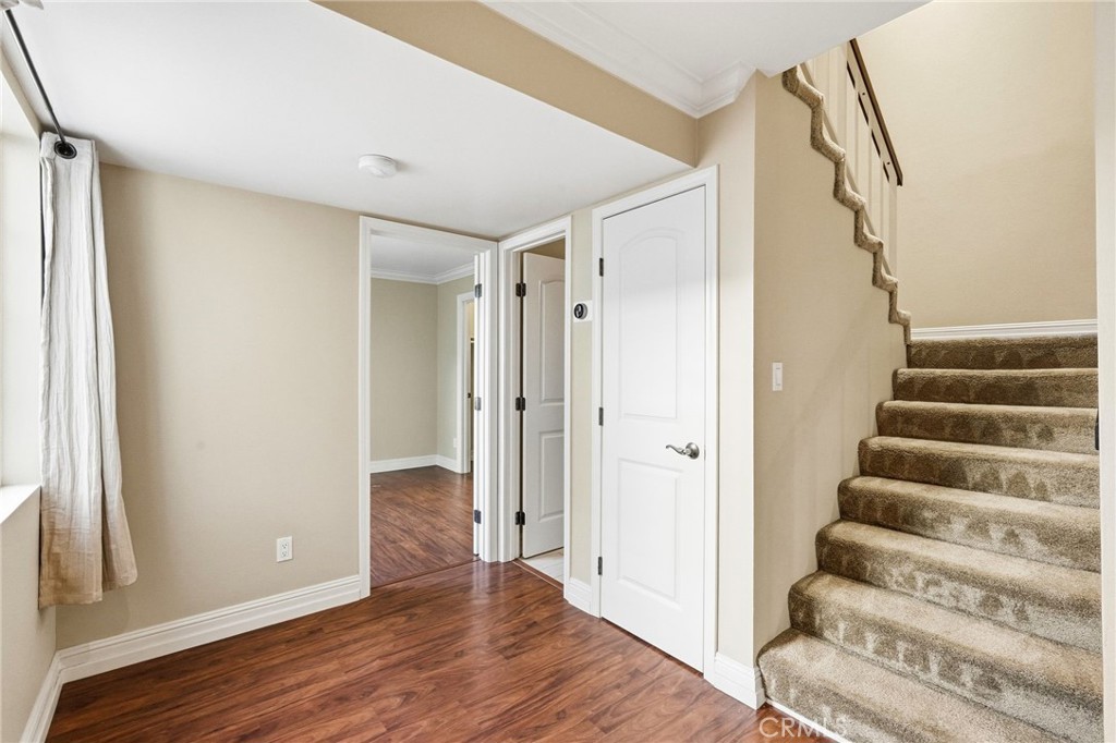 19208 Hamlin Street, Unit 5 Reseda, CA 91335 - Photo 12 of 31 a view of an entryway with wooden floor and staircase