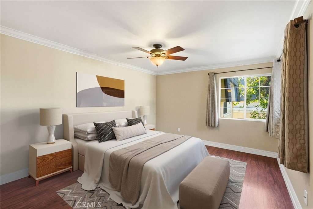 19208 Hamlin Street, Unit 5 Reseda, CA 91335 - Photo 15 of 31 a bedroom with a bed and a chandelier