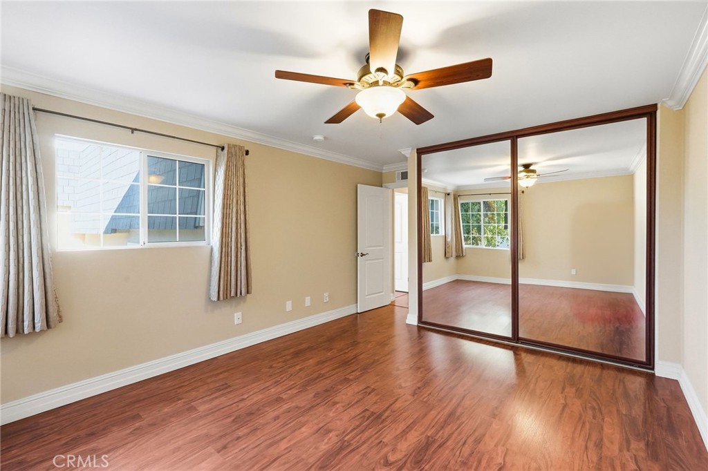 19208 Hamlin Street, Unit 5 Reseda, CA 91335 - Photo 17 of 31 a view of an empty room with wooden floor and a window