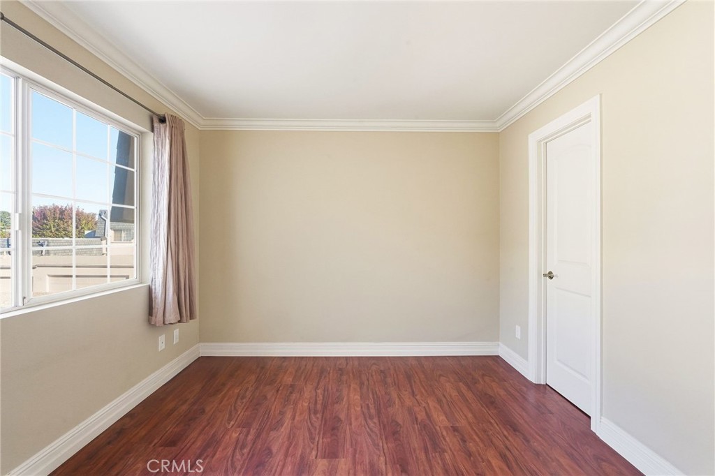 19208 Hamlin Street, Unit 5 Reseda, CA 91335 - Photo 19 of 31 a view of a room with wooden floor and windows
