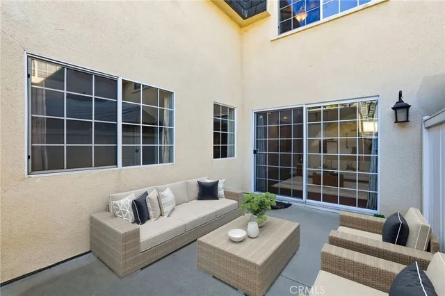 a view of living room with large window and a couch