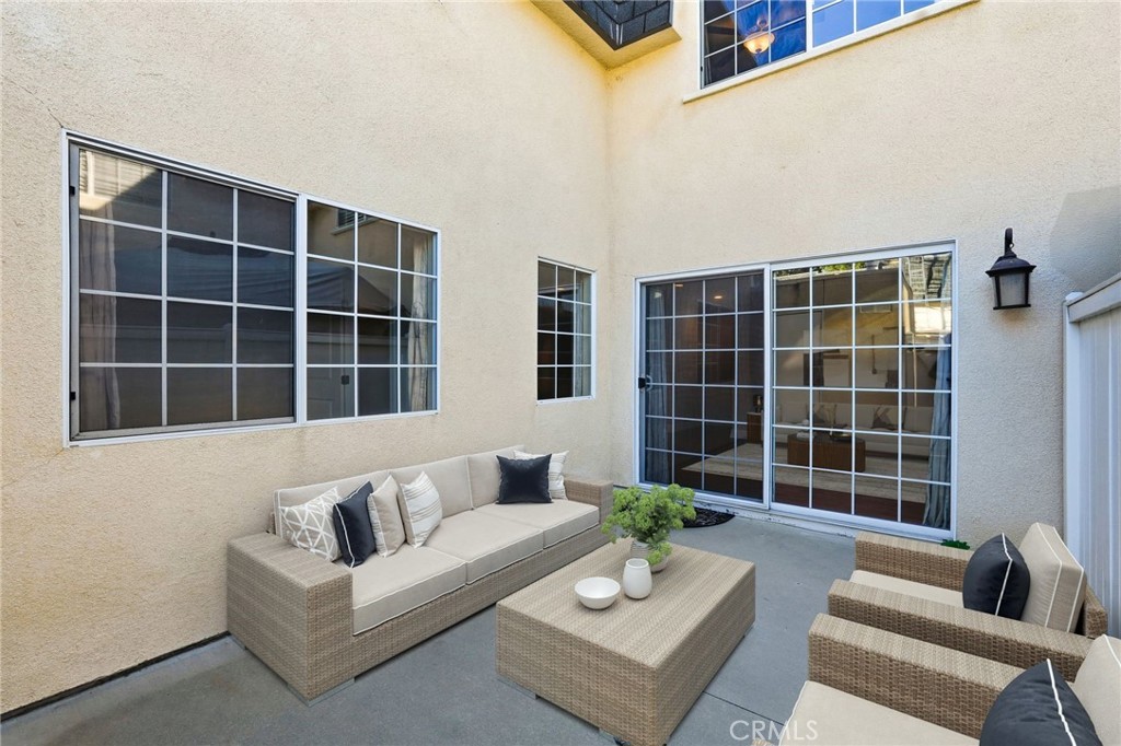 19208 Hamlin Street, Unit 5 Reseda, CA 91335 - Photo 21 of 31 a view of living room with large window and a couch