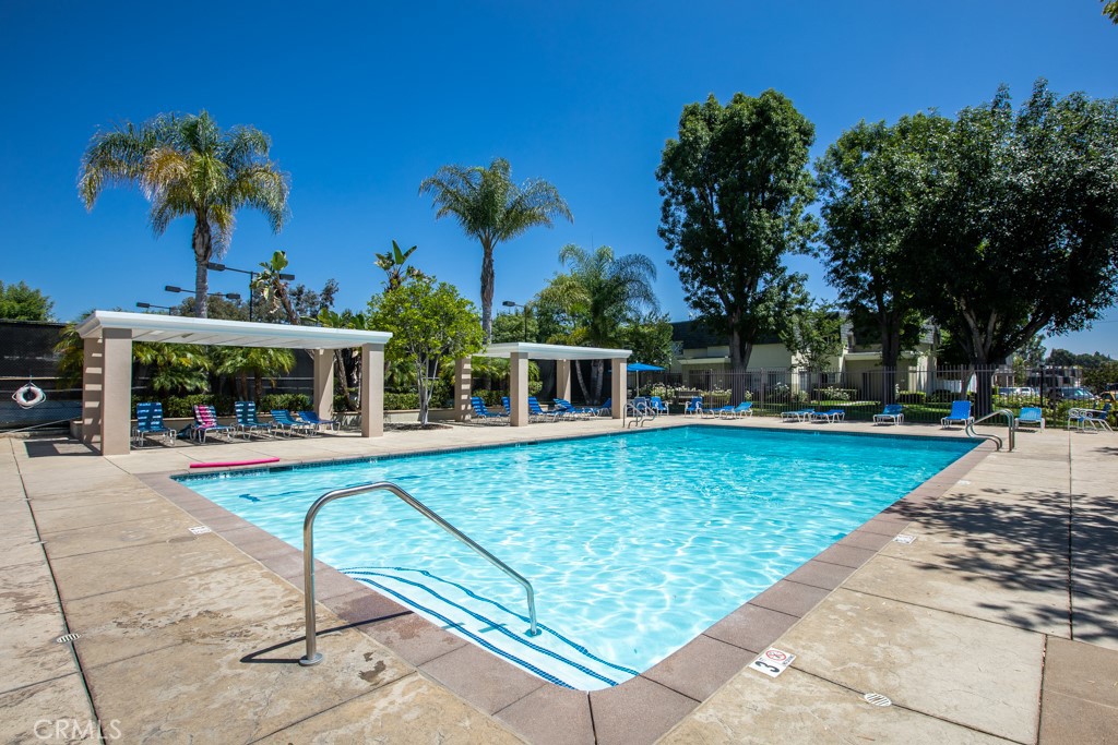 19208 Hamlin Street, Unit 5 Reseda, CA 91335 - Photo 24 of 31 front view of a house with a swimming pool