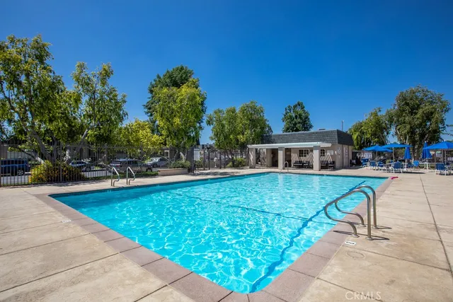 a view of a swimming pool with chairs
