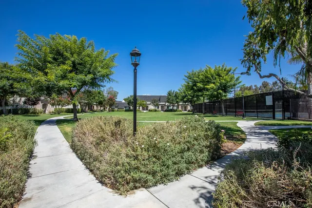 a view of a garden with a fountain