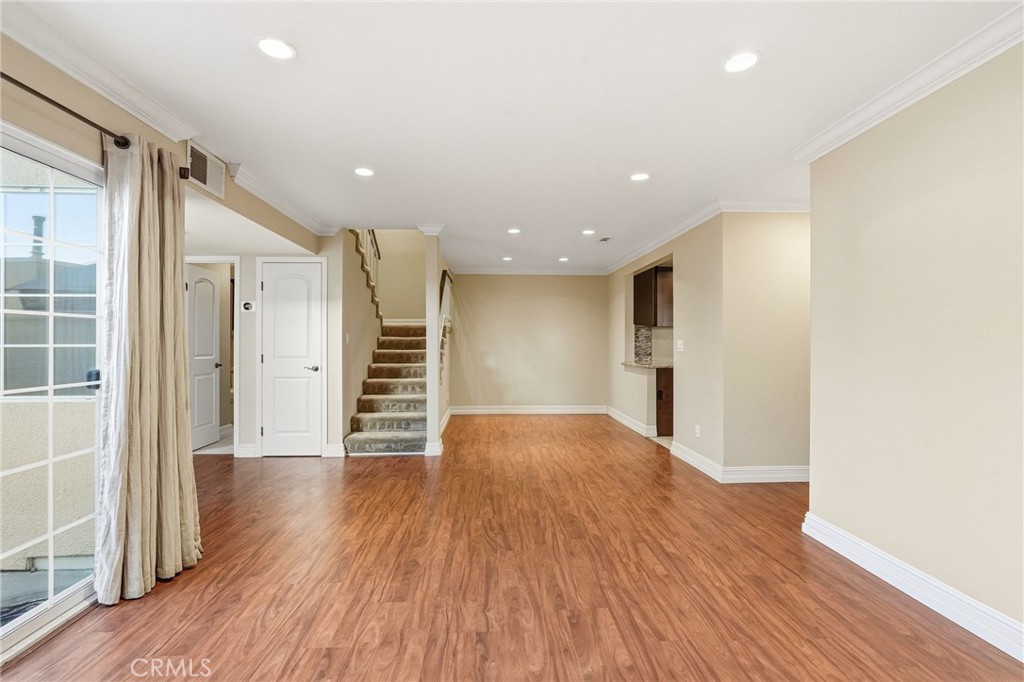 19208 Hamlin Street, Unit 5 Reseda, CA 91335 - Photo 7 of 31 a view of a big room with wooden floor and windows