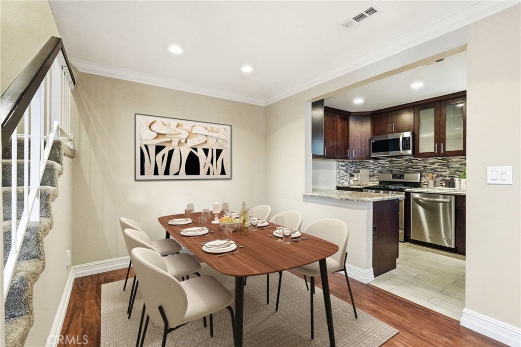 19208 Hamlin Street, Unit 5 Reseda, CA 91335 - Photo 8 of 31 a view of a dining room with furniture