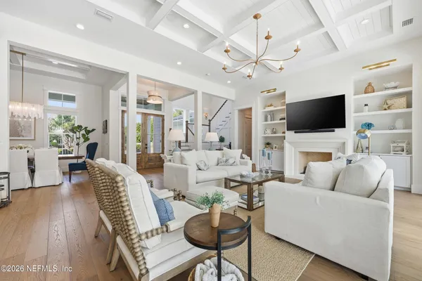 a front view of a house with garden and porch