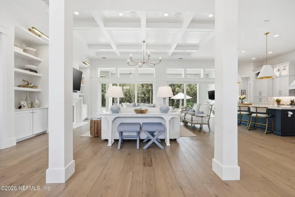 a kitchen with kitchen island granite countertop a sink a counter top space stainless steel appliances and cabinets