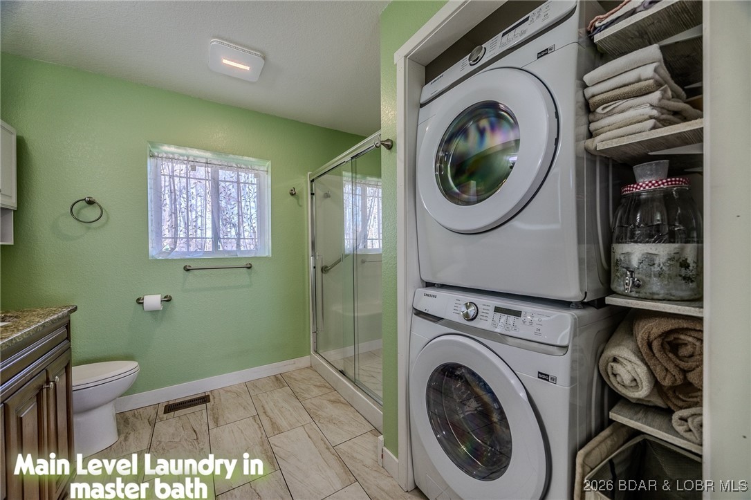 81 Restless Point Camdenton, MO 65020 - Photo 35 of 75 Primary bath with full laundry