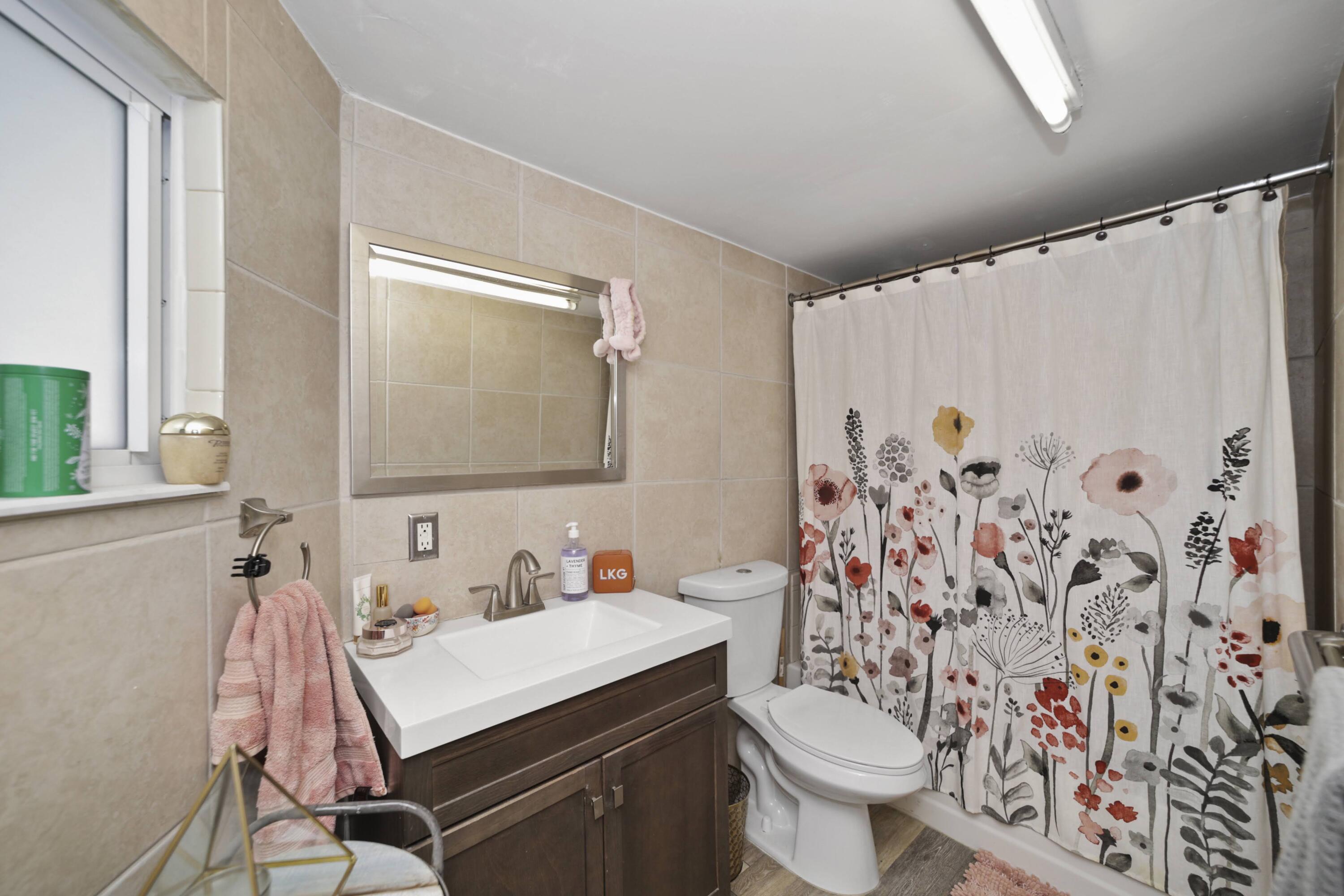 Undisclosed Address Lighthouse Point, FL 33064 - Photo 11 of 16 a bathroom with a sink toilet and shower