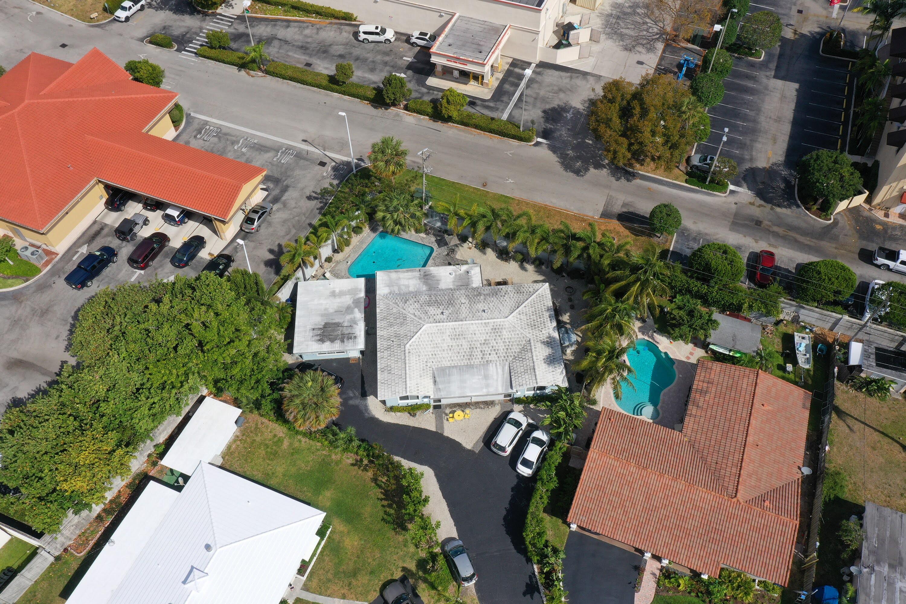 Undisclosed Address Lighthouse Point, FL 33064 - Photo 13 of 16 an aerial view of a house with a yard and pool