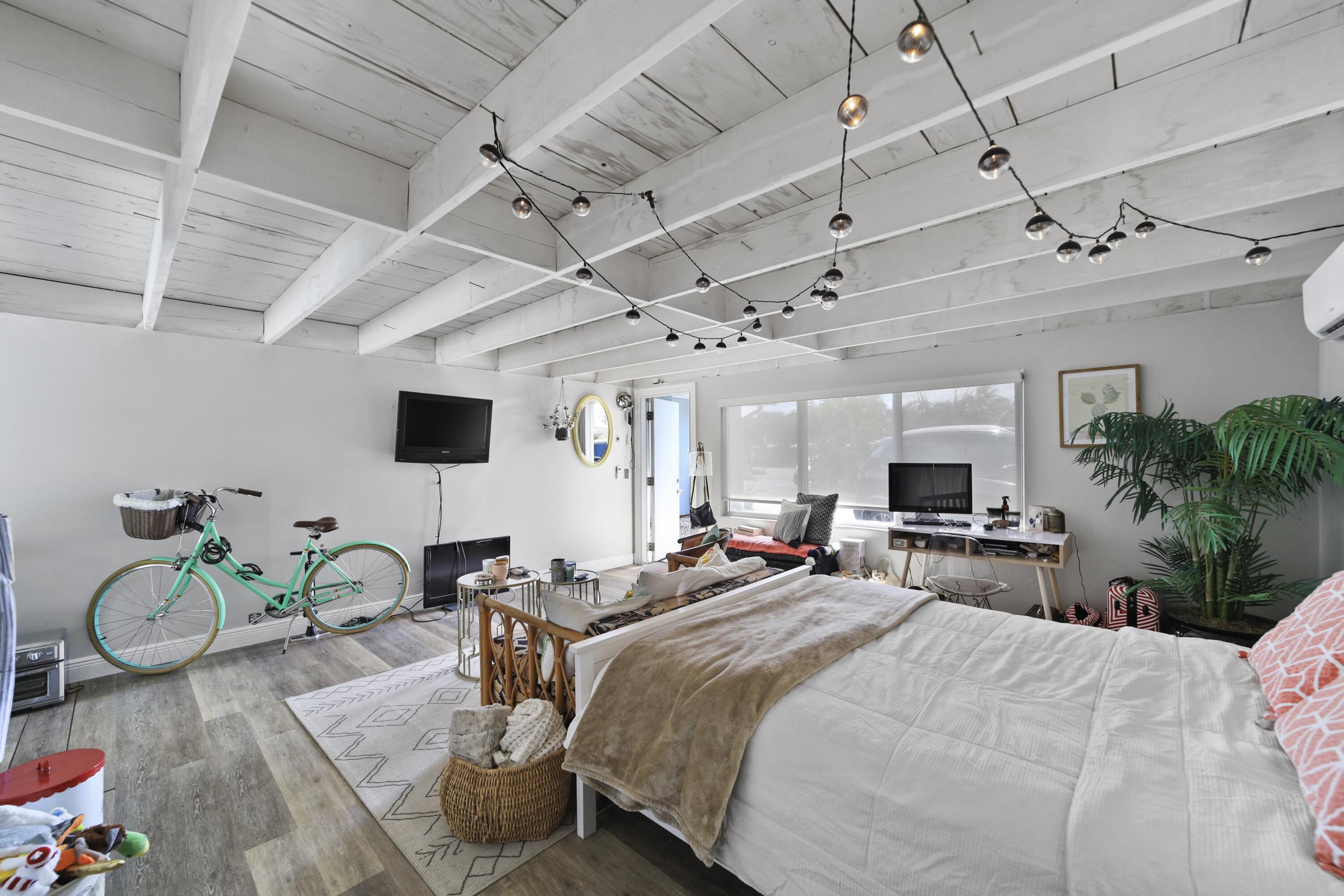Undisclosed Address Lighthouse Point, FL 33064 - Photo 14 of 16 a bedroom with a bed and a flat screen tv
