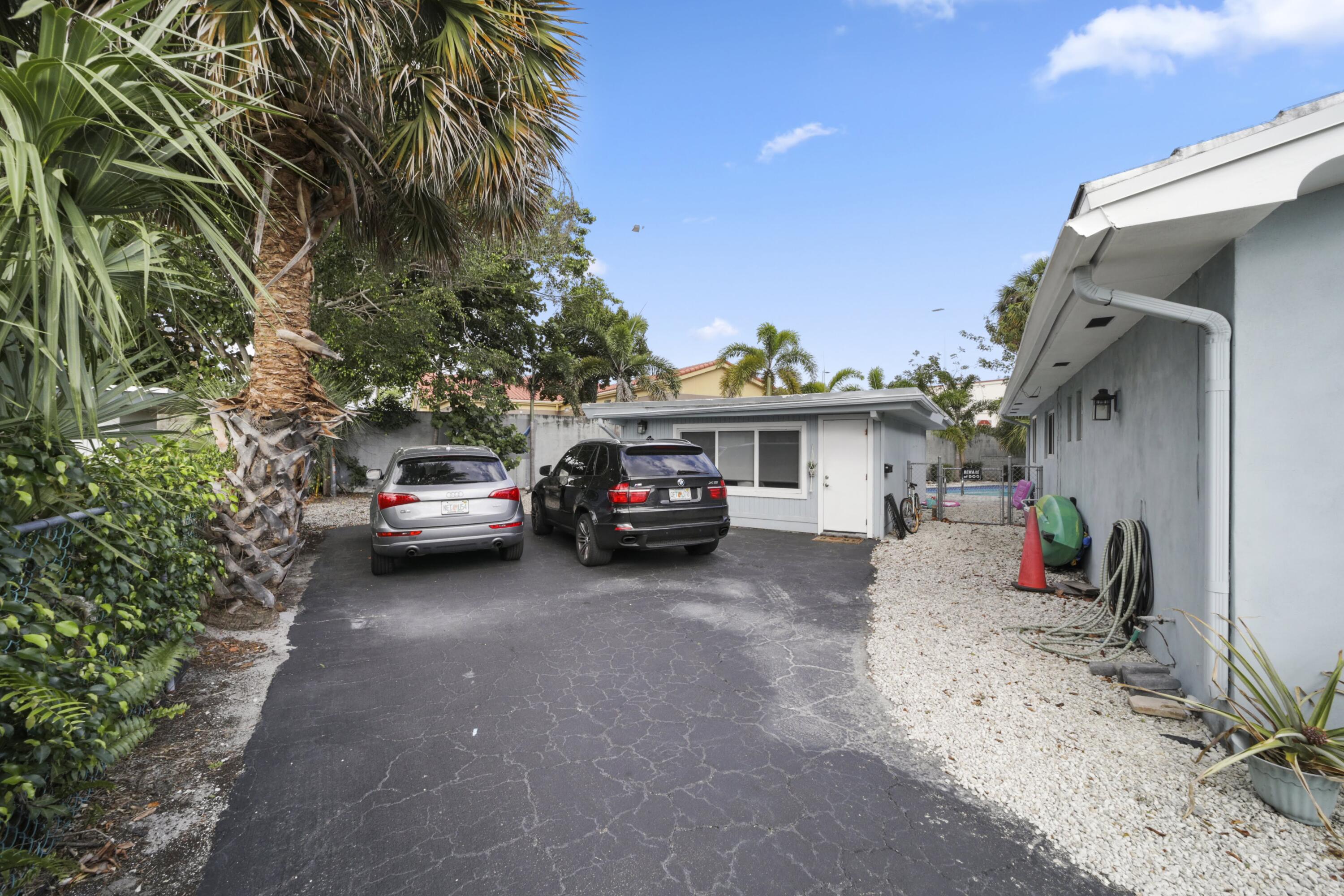 Undisclosed Address Lighthouse Point, FL 33064 - Photo 5 of 16 a view of a car in front of house