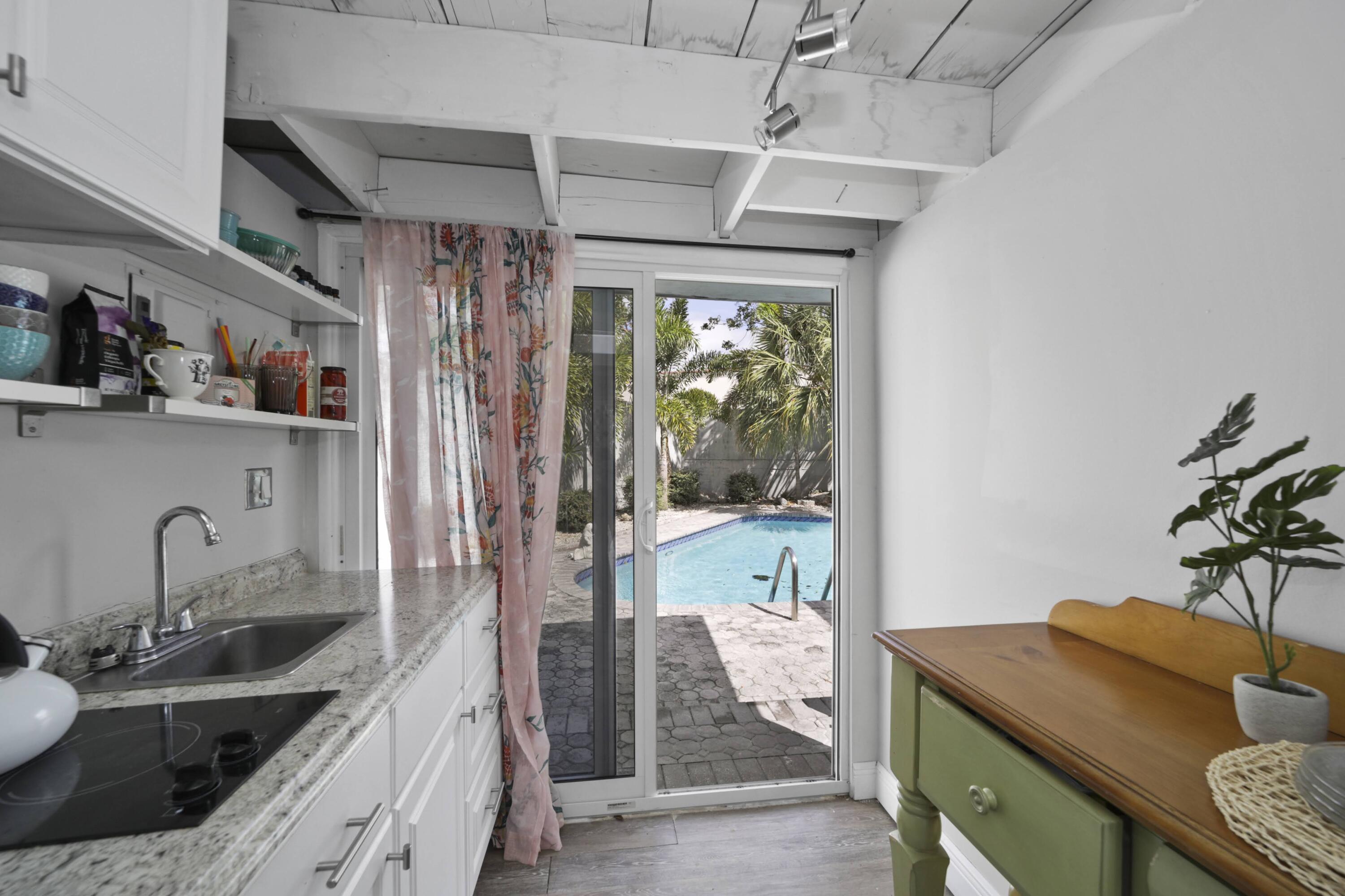 Undisclosed Address Lighthouse Point, FL 33064 - Photo 6 of 16 a kitchen with a sink stove and refrigerator