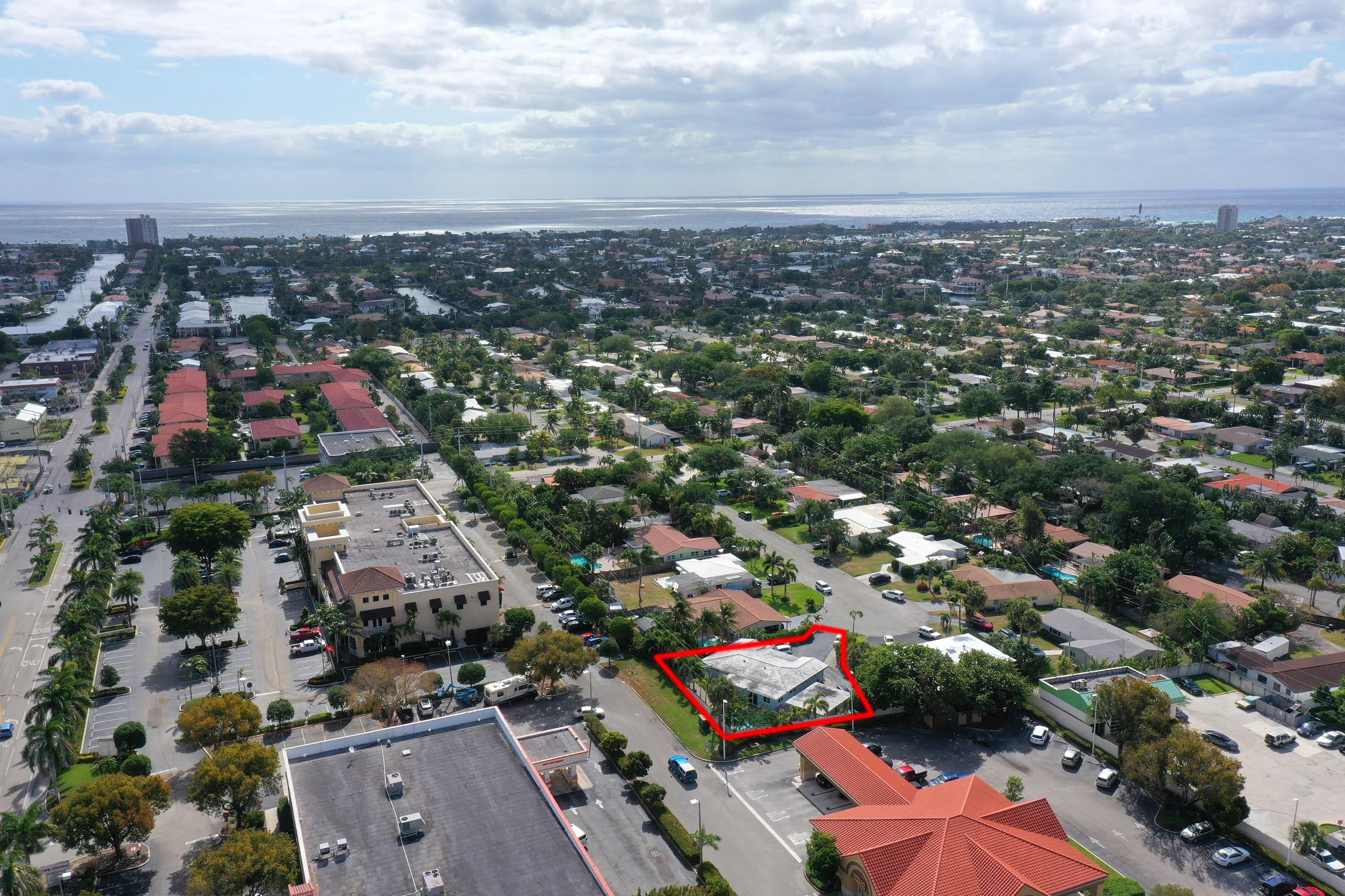 Undisclosed Address Lighthouse Point, FL 33064 - Photo 9 of 16 an aerial view of a city