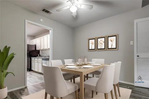 a view of a dining room with furniture and wooden floor