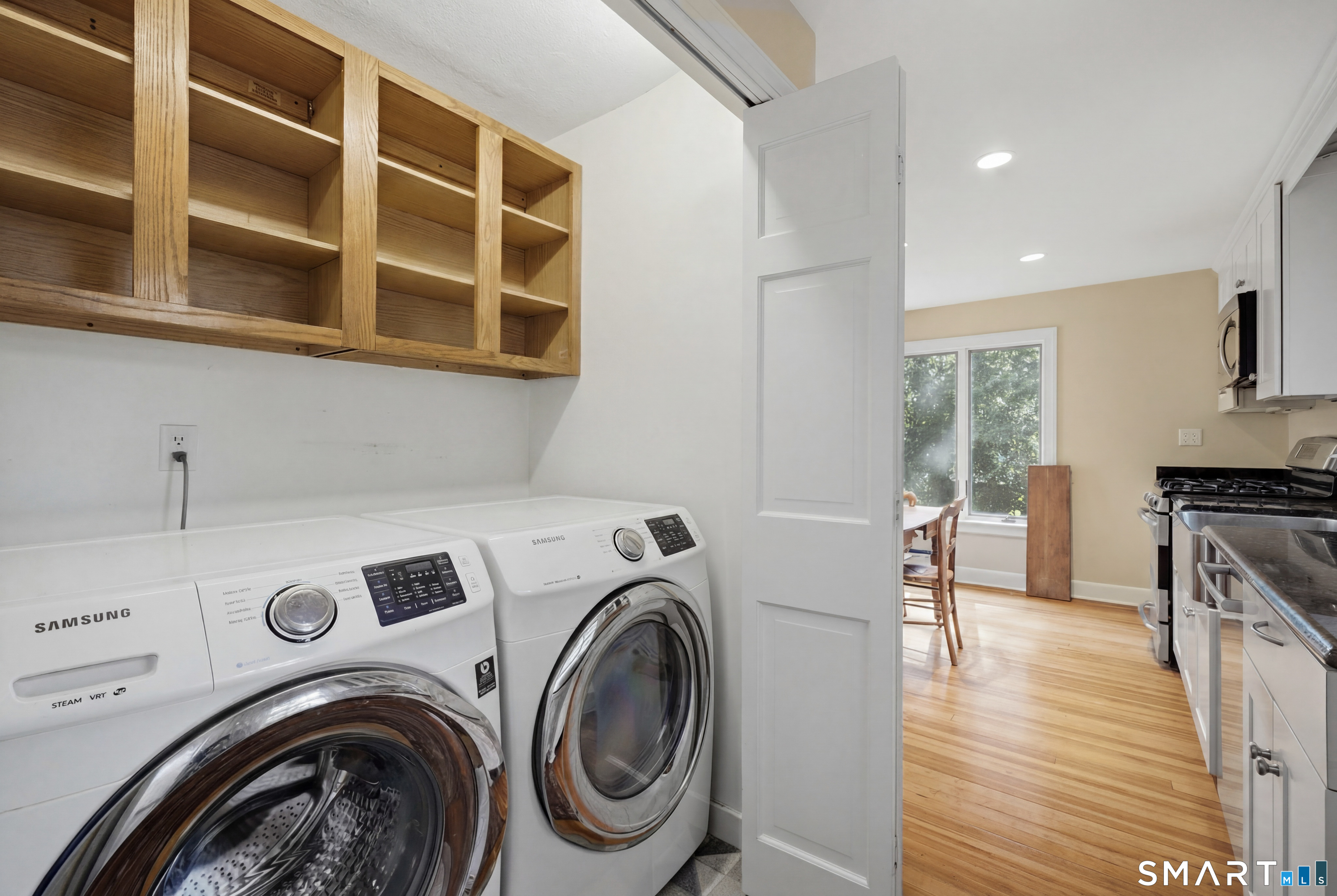 9 Stratford Road West Hartford, CT 06117 - Photo 14 of 40 The kitchen's thoughtful layout includes a convenient laundry area tucked seamlessly into the space
