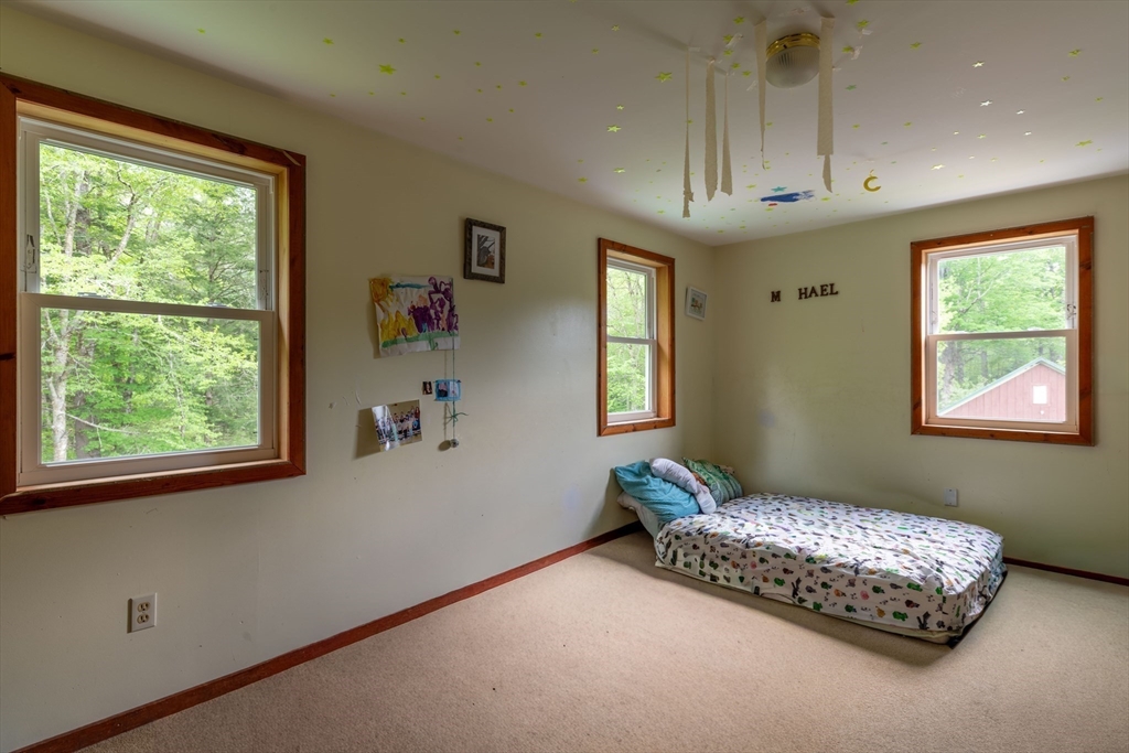 425 Dingle Road Worthington, MA 01098 - Photo 17 of 32 a bedroom with a bed and a window