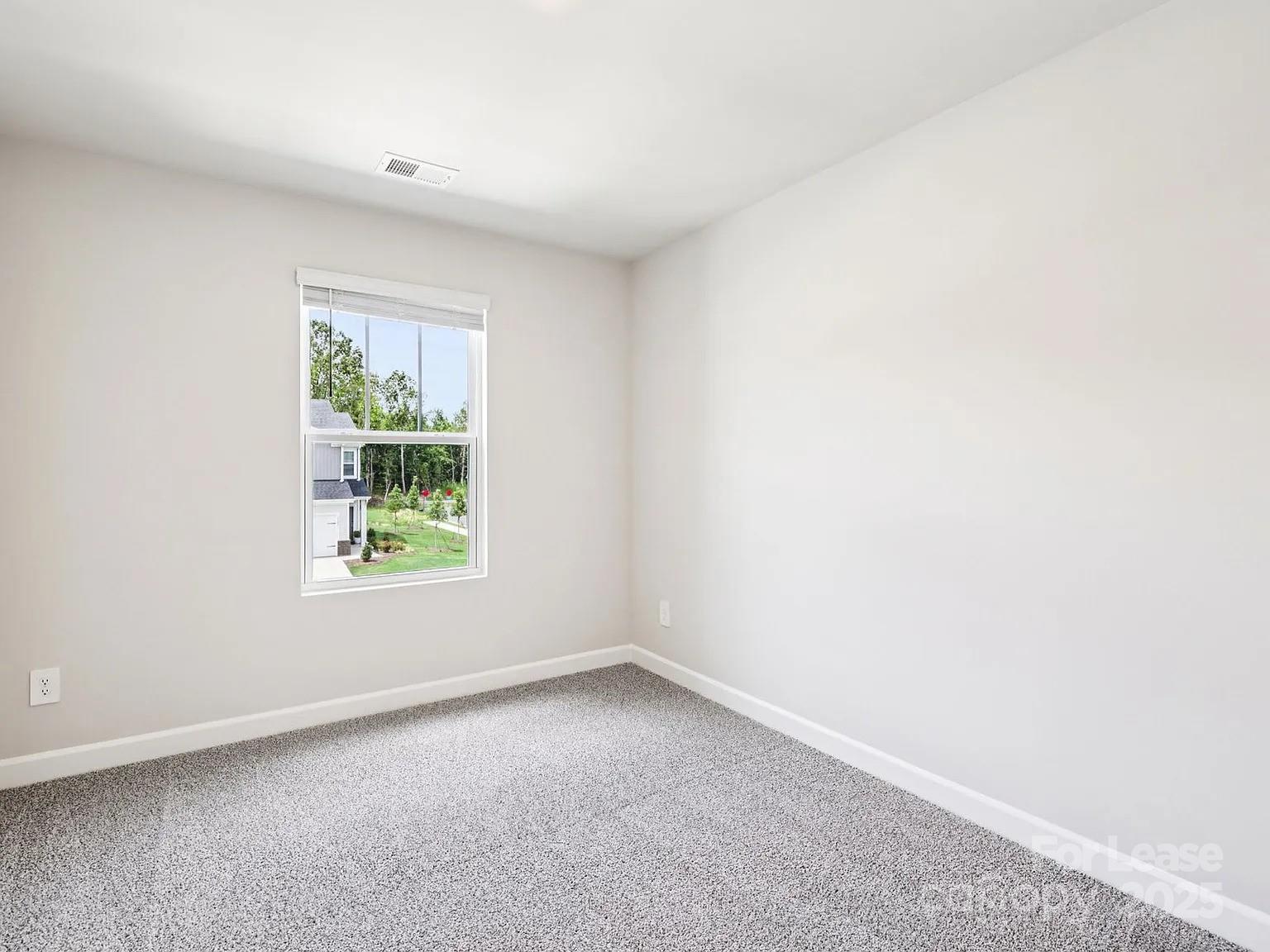 6122 Starview Terrace Charlotte, NC 28216 - Photo 11 of 19 an empty room with windows