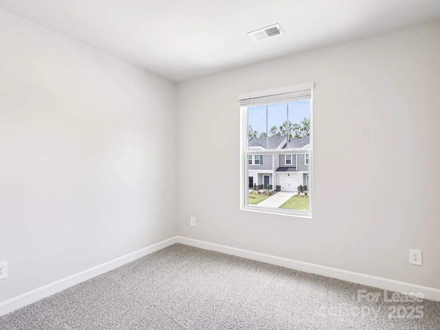 6122 Starview Terrace Charlotte, NC 28216 - Photo 12 of 19 an empty room with windows