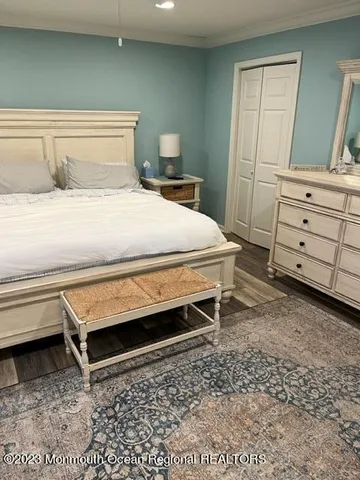 a bedroom with a bed and a cabinets