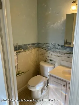 a bathroom with a toilet and a sink