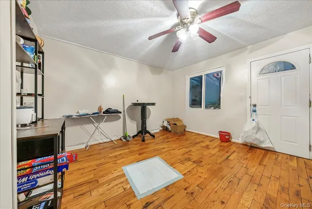 a bed room with a bed and a flat tv screen on a dresser