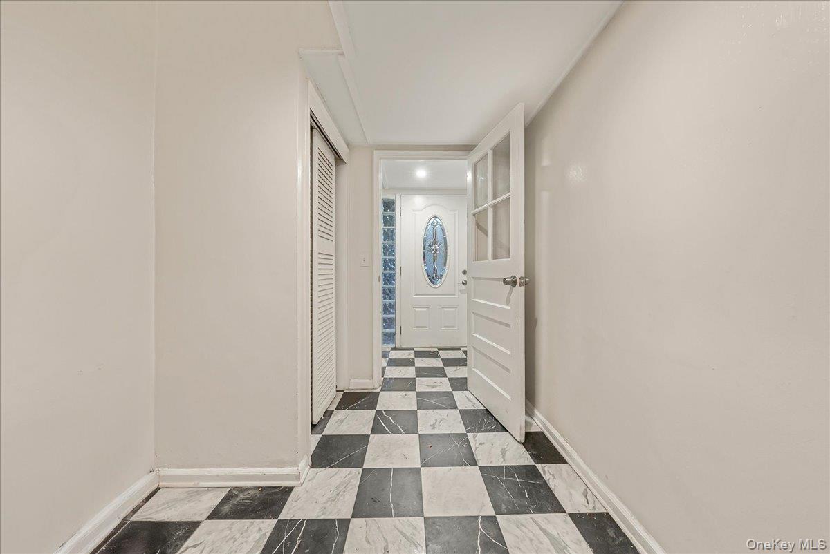 4183 Murdock Avenue Bronx, NY 10466 - Photo 15 of 22 a view of a bathroom with a black and white checkered floor