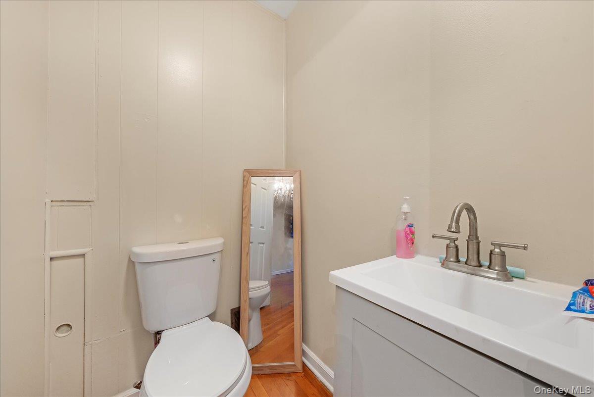 4183 Murdock Avenue Bronx, NY 10466 - Photo 16 of 22 a bathroom with a toilet sink and mirror