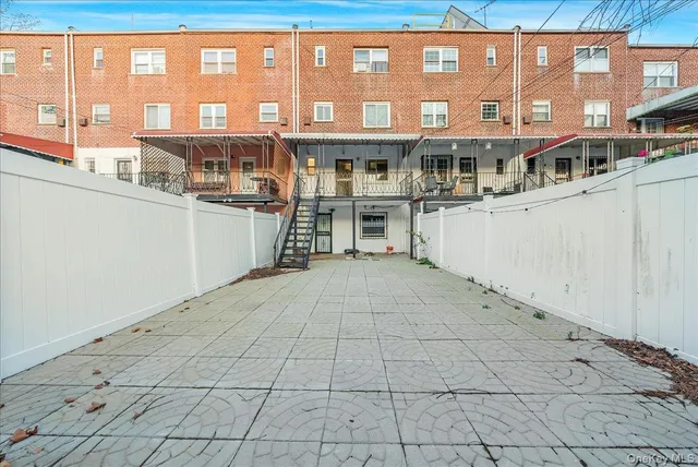 a view of a building with sitting area