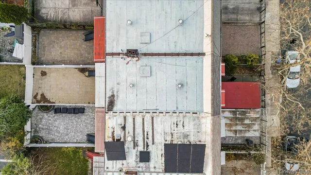aerial view of a house with wooden fence