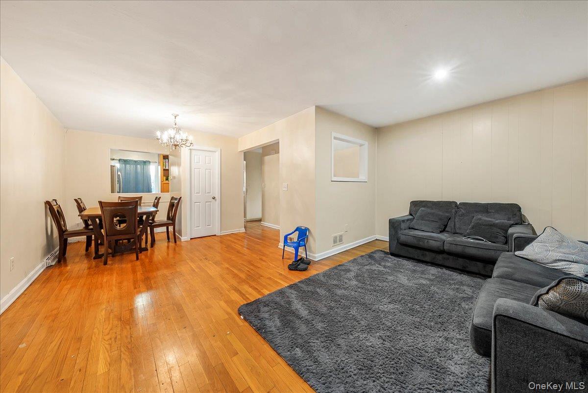 4183 Murdock Avenue Bronx, NY 10466 - Photo 3 of 22 a living room with furniture and a wooden floor