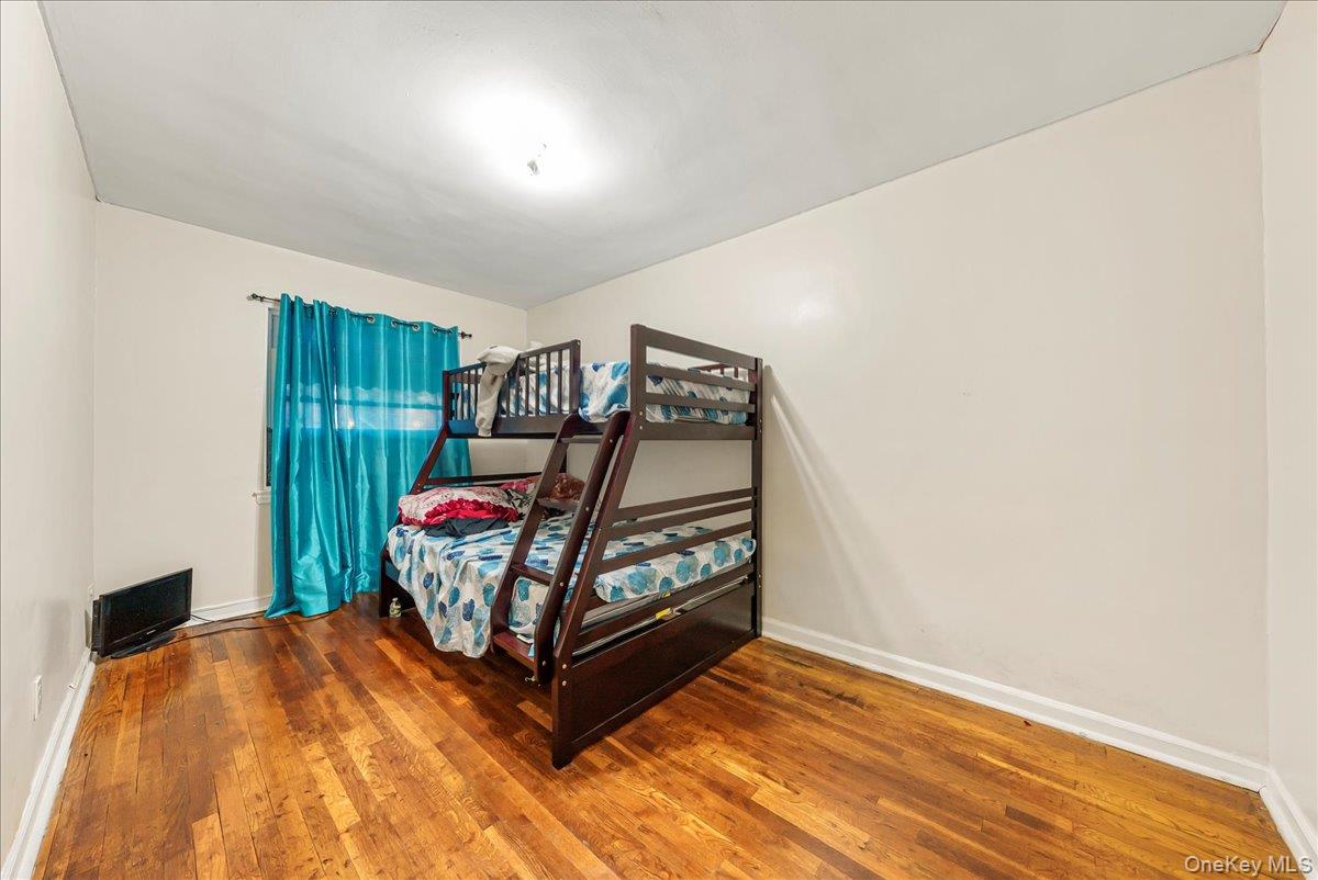 4183 Murdock Avenue Bronx, NY 10466 - Photo 8 of 22 a bedroom with a bed and a window