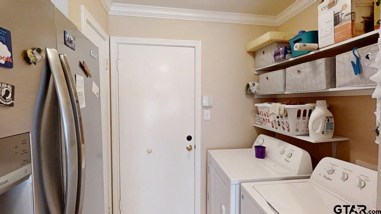 1202 Rice Road, Unit 143 Tyler, TX 75703 - Photo 12 of 27 a utility room with dryer and washer