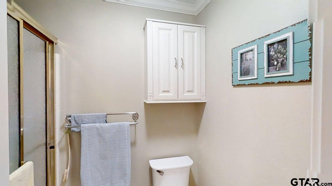 1202 Rice Road, Unit 143 Tyler, TX 75703 - Photo 17 of 27 a bathroom with a toilet