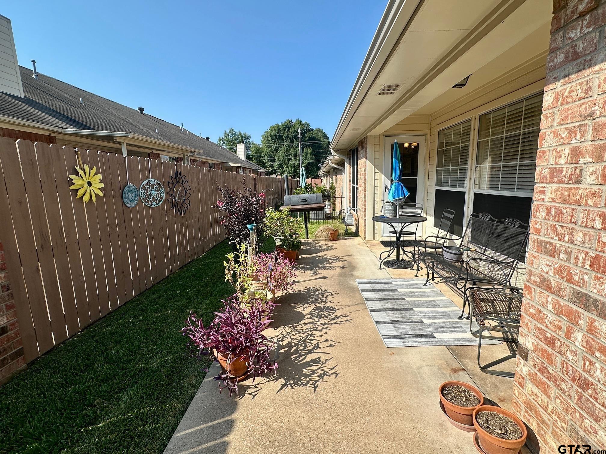 1202 Rice Road, Unit 143 Tyler, TX 75703 - Photo 27 of 27 a view of yard with patio
