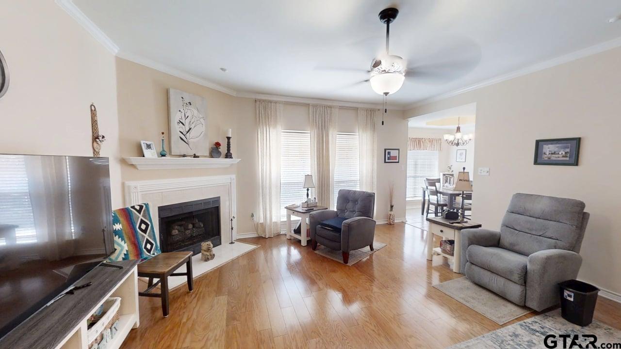 1202 Rice Road, Unit 143 Tyler, TX 75703 - Photo 5 of 27 a living room with furniture fireplace and window