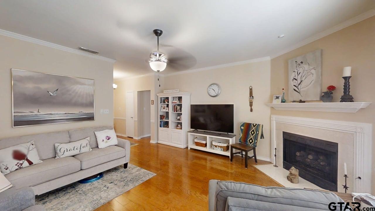 1202 Rice Road, Unit 143 Tyler, TX 75703 - Photo 7 of 27 a living room with furniture and a flat screen tv